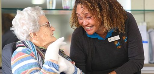 IRT carer smiling with elderly woman in retirement village