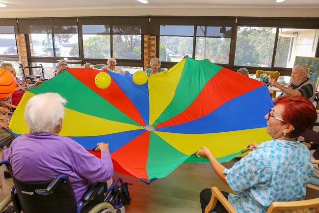 Lifestyle Officer Claudia Duck (bottom right) and residents at a Sit and Be Fit class.