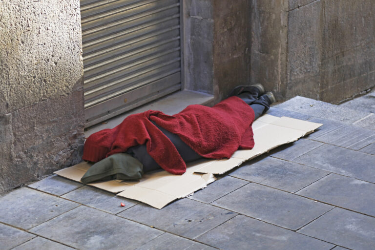 Homeless person sleeping on street