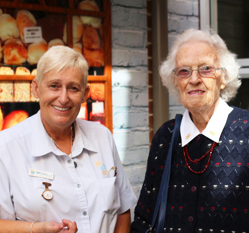 Aged care nurse with elderly woman